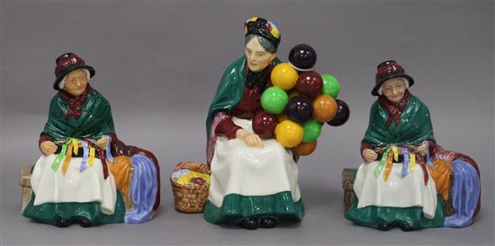 Three Royal Doulton figures: two Silks and Ribbons HN2017 and Old Balloon Seller HN1315